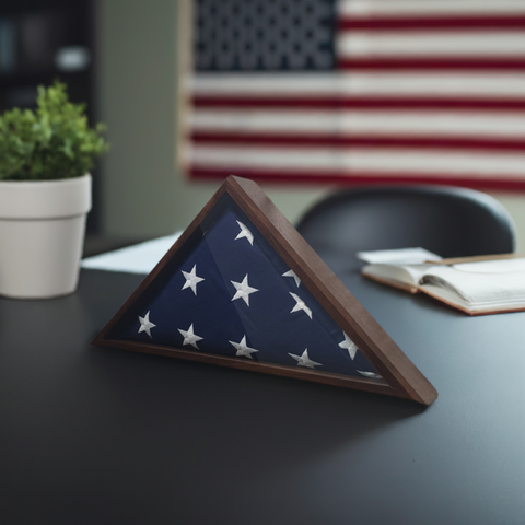 A 4'x6' Flag Display Case made out of Walnut hardwood and glass. Shown with 4'x6' flag. Sitting on a desk.